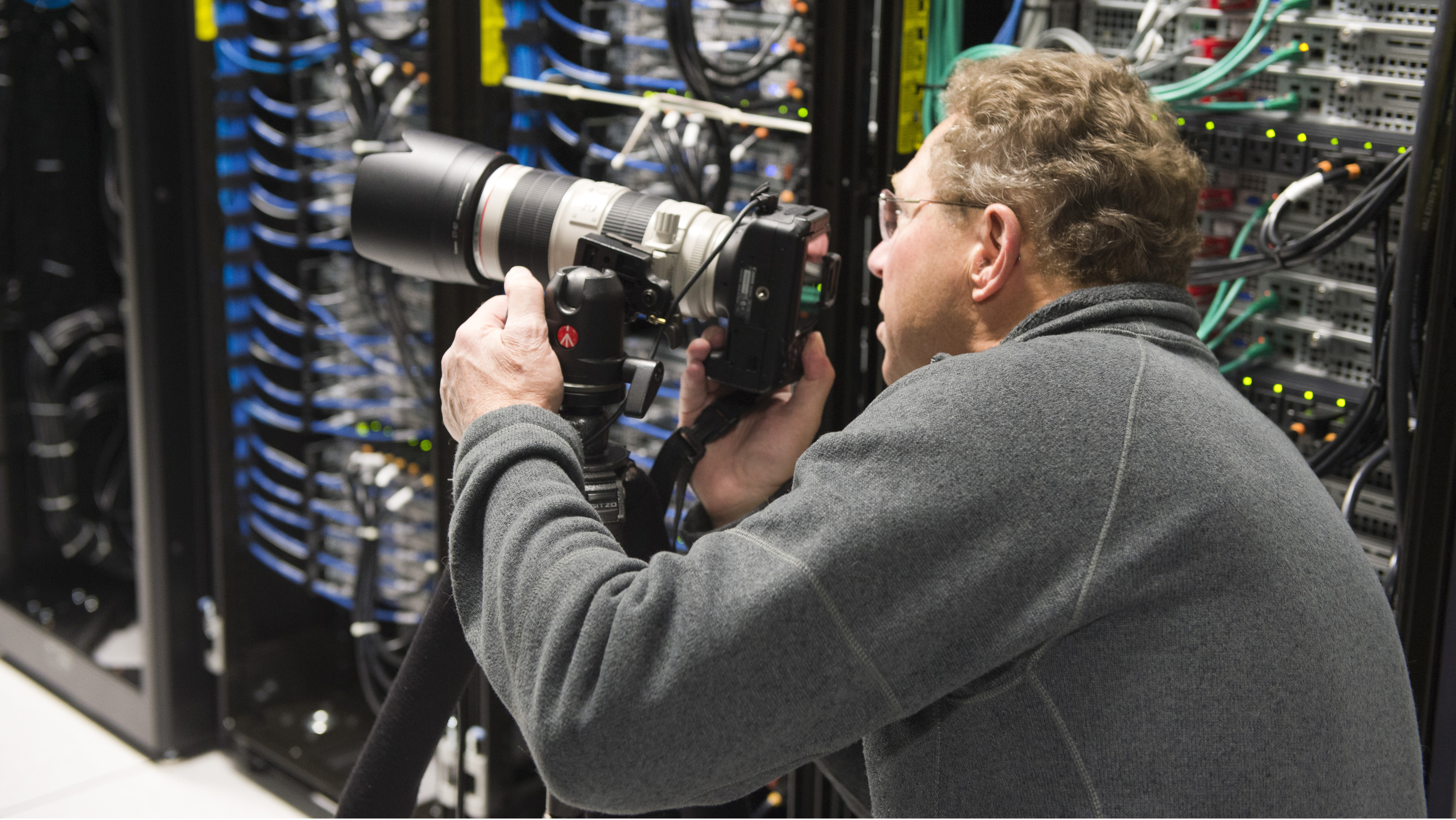 Photo of a photographer lines up his shot at the Fermilab Particle Physics Photowalk
