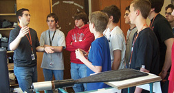 Marshall Burhoff (left) explains his work with the QuarkNet