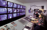 Operators remotely maintain the SNS target area.