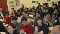 Students around the world participate in videoconferences, lectures, and analysis of particle physics data.