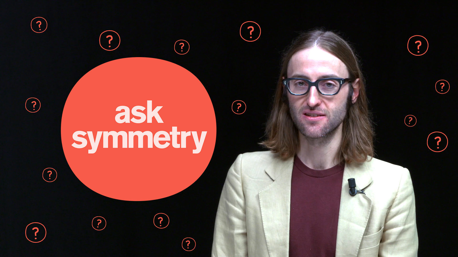 Photo of James Lead with "Ask symmetry" for Why do objects feel solid? article