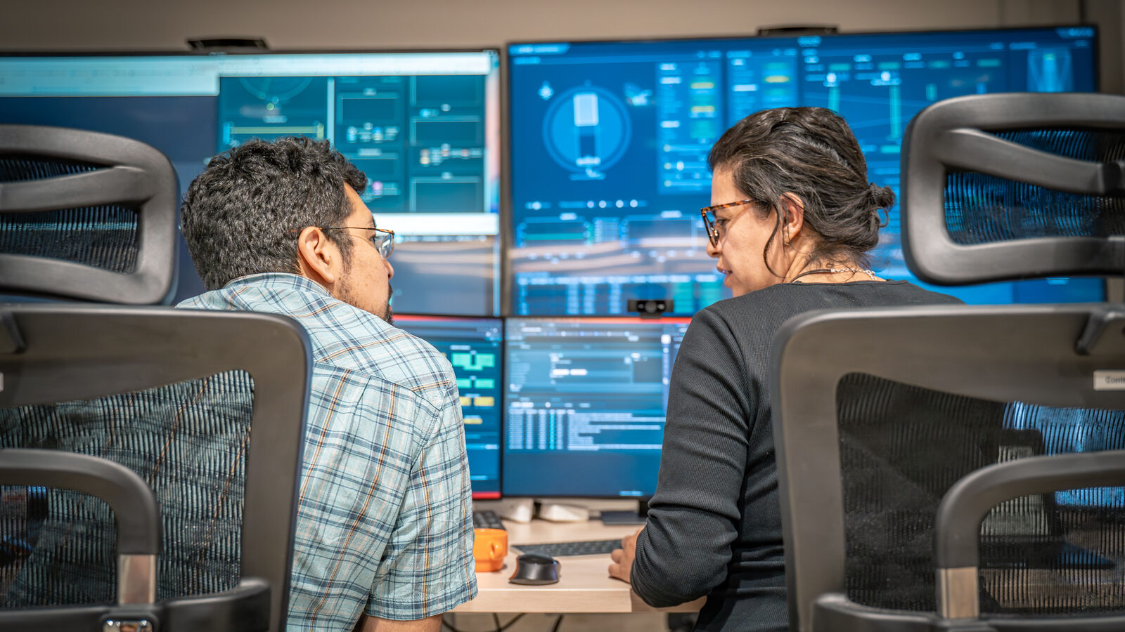 NOIRLab observing specialists Carlos Morales (left) and Karla Peña (right) in the Rubin summit control room at Rubin’s mountaintop site of Cerro Pachón, Chile.