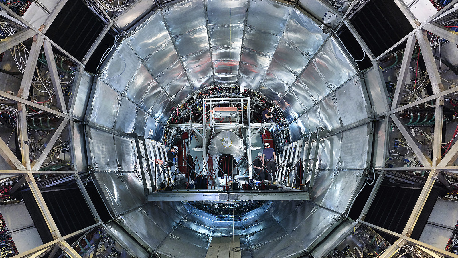 Technicians work inside ALICE