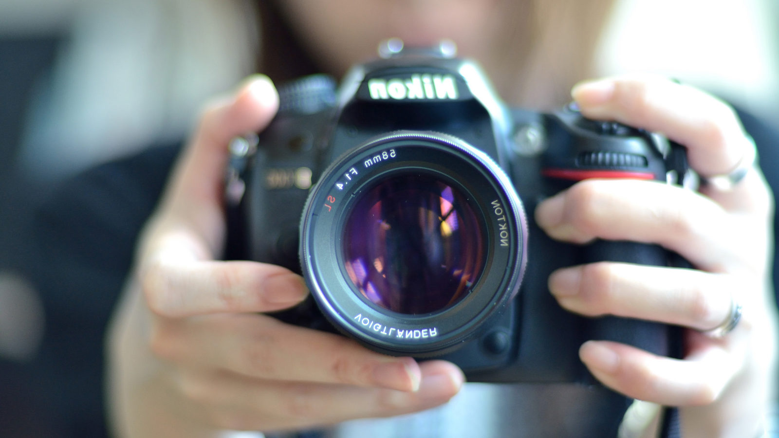 Image of person holding a camera