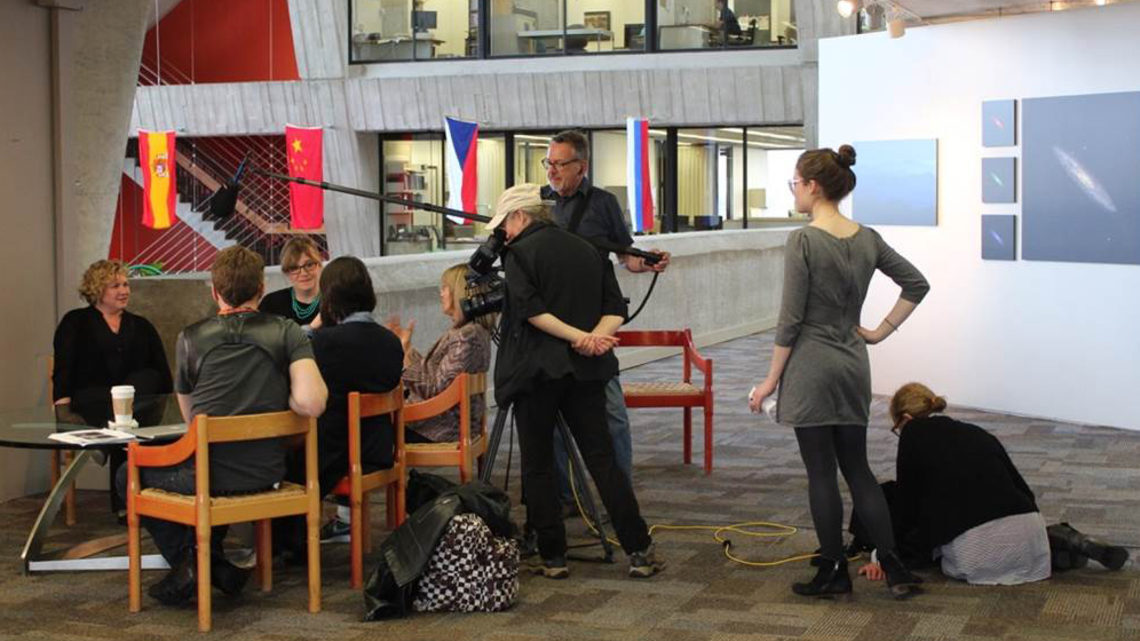 Photo of Ellen Sandor and (art)n meet with scientists at Fermilab