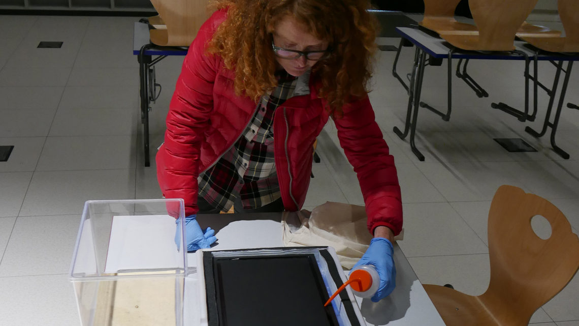 Photo of Ruth Jarman making a cloud chamber at CERN