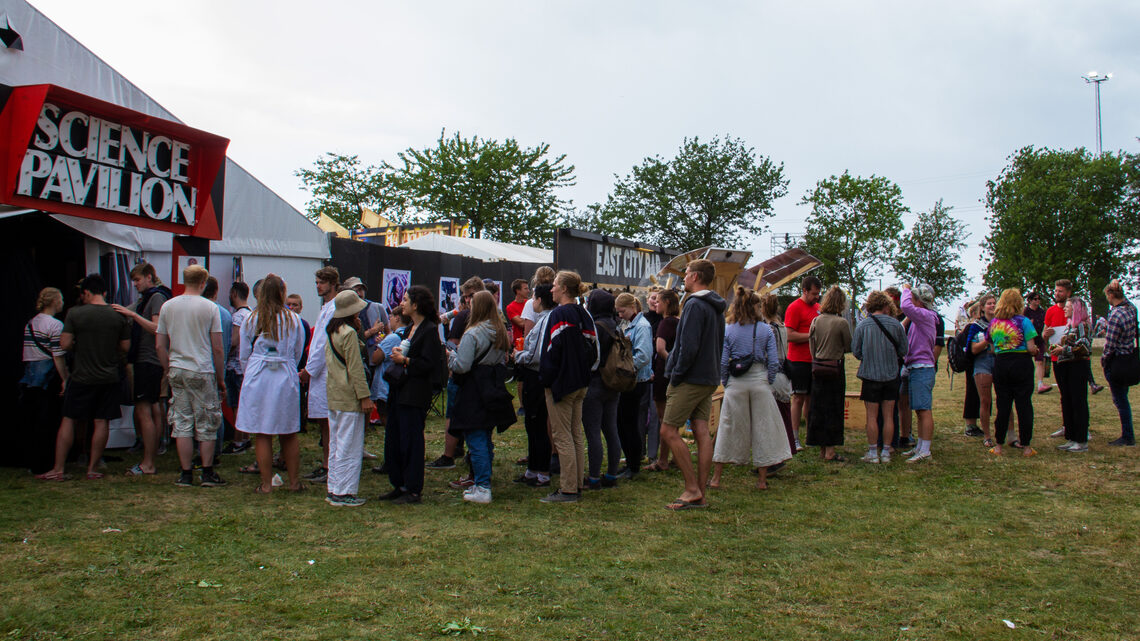 A line of people waiting to enter the science pavilion