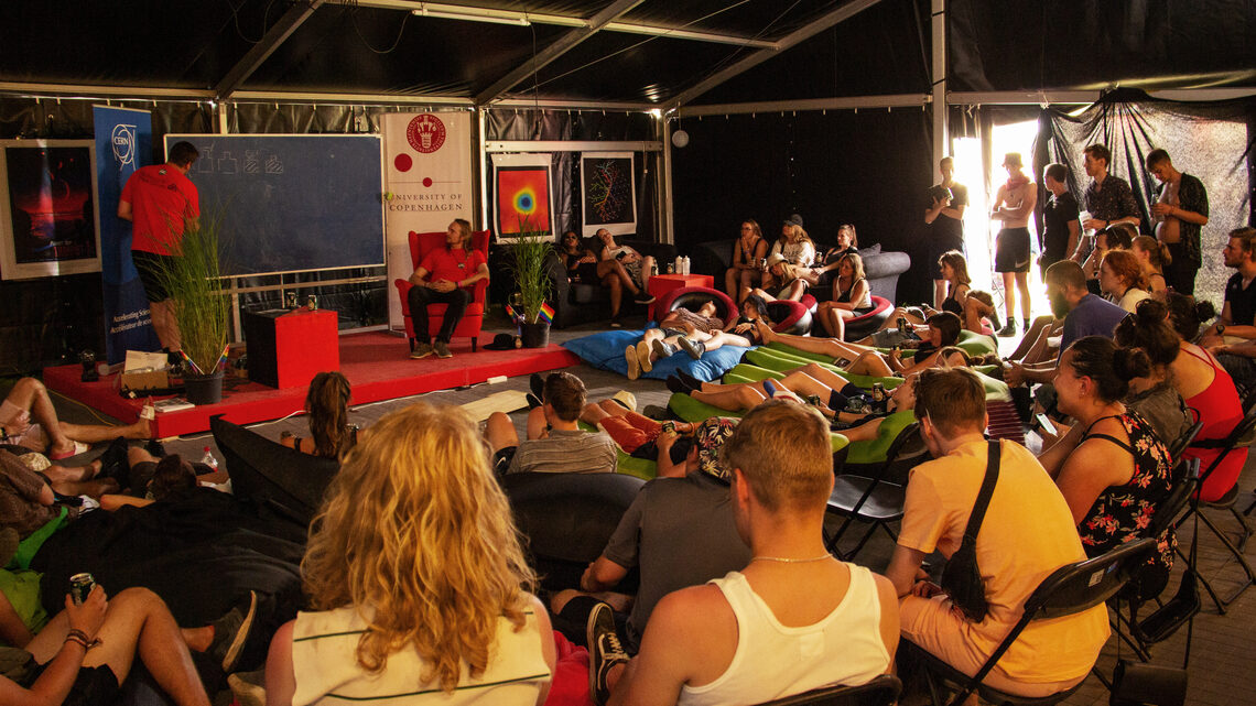 An audience watches the performance