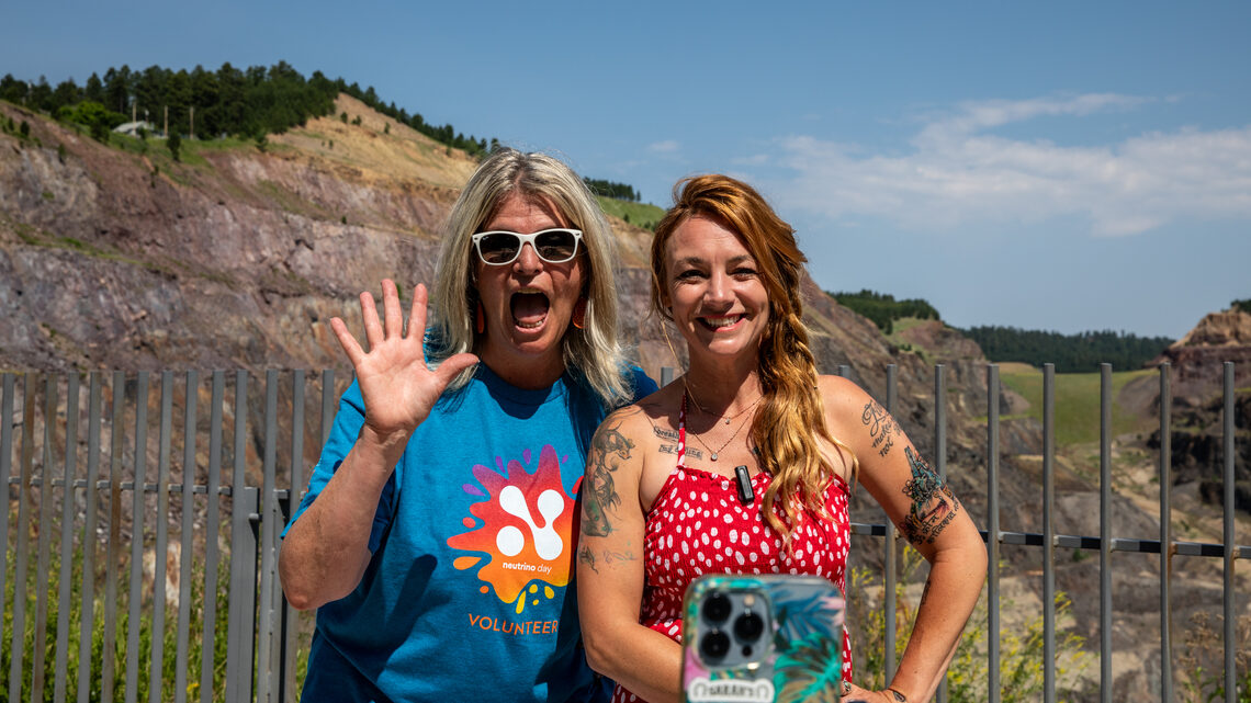 Two people in front of a camera for a live broadcast from Neutrino Day