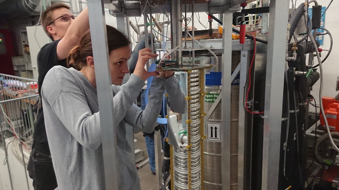 Researchers assemble components in the test detector at the University of Bern.