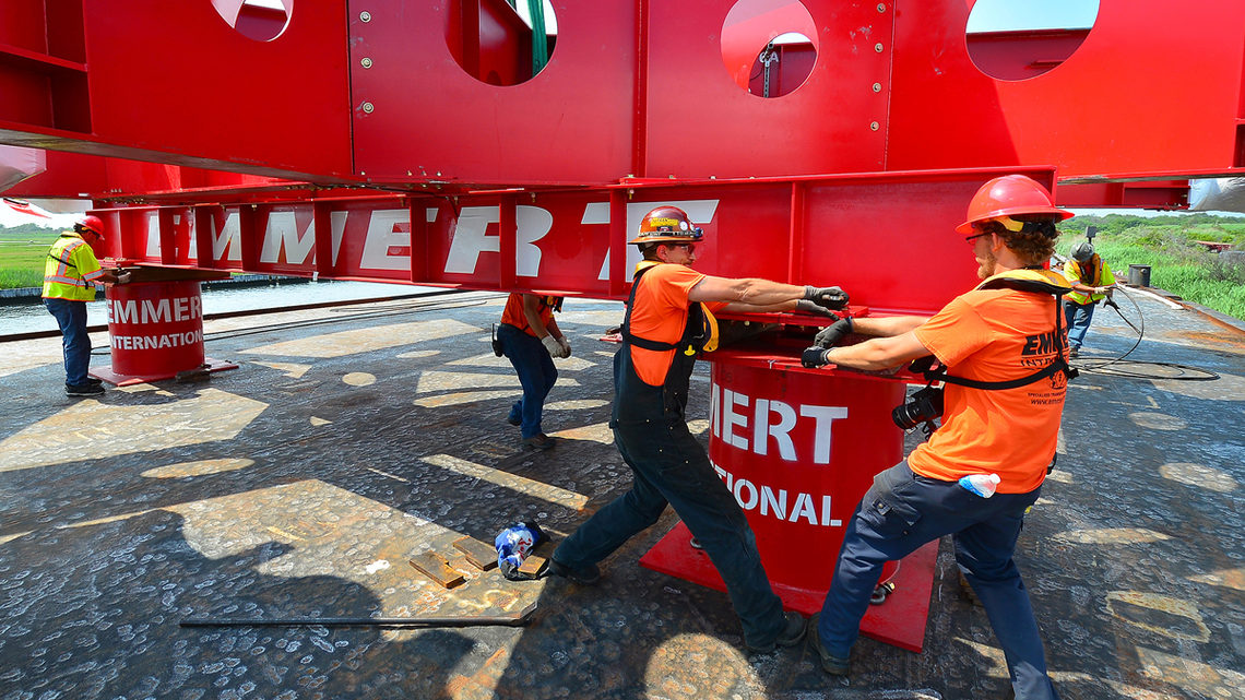 Photo of Emmert International employees affixed the Muon g-2 ring
