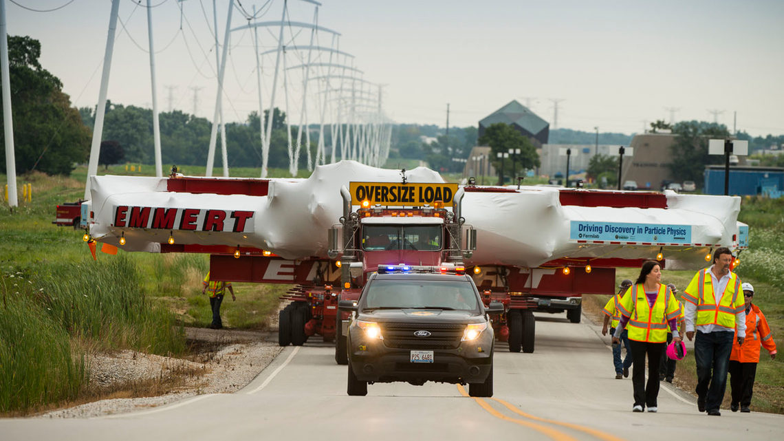 Emmert International employees and Muon g-2 scientists walking alongside it, the muon detector made its way across Fermilab