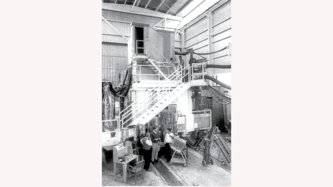 SLAC physicists standing around the SLAC streamer chamber that Leroy helped build. (SLAC National Accelerator Laboratory Archive