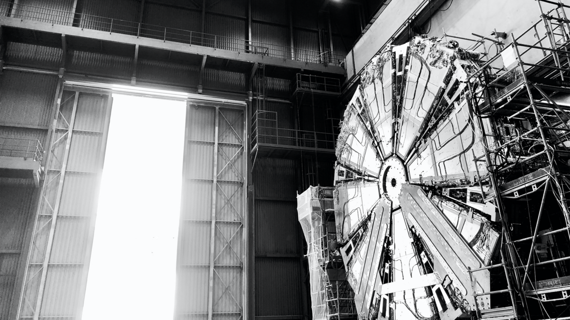 Black and white photo of a multi-story detector component