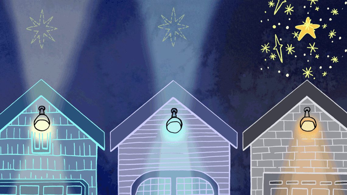 Three garage doors at night time with stars above