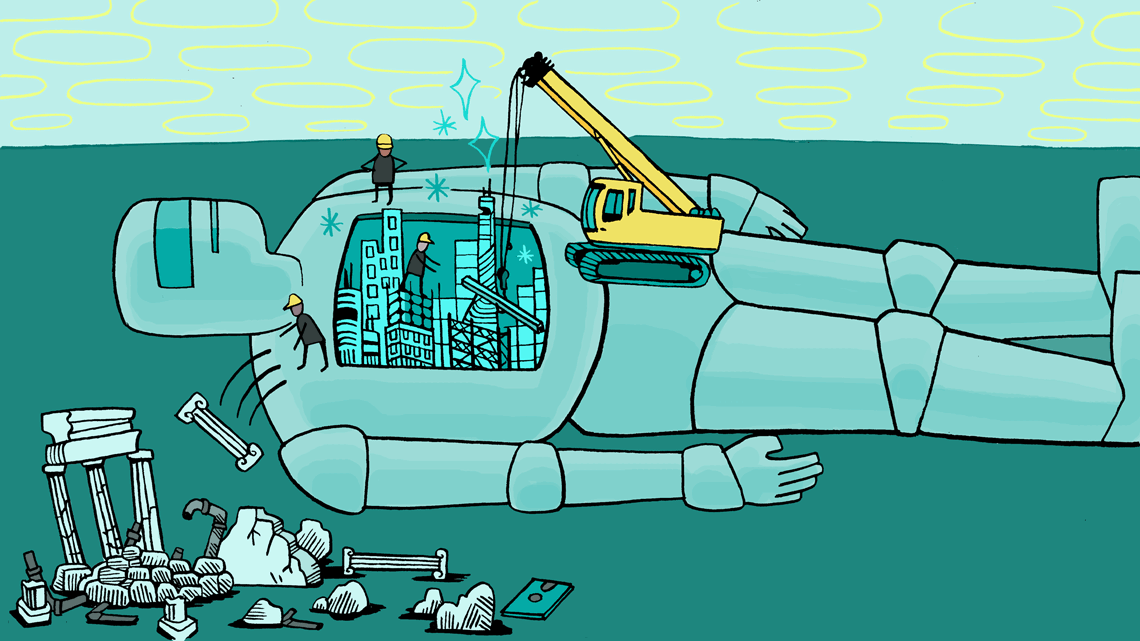 Robot laying down on ground with scientists working on the inside of it 