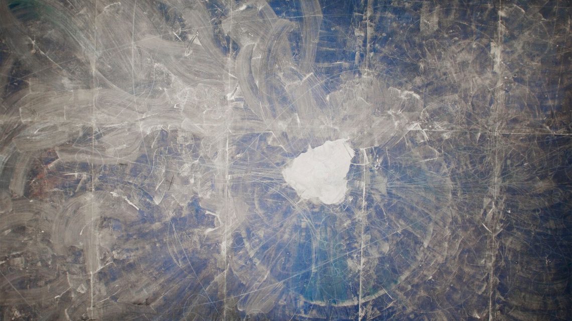 Overhead photograph of the pile of white sand left at the center of the blueprint