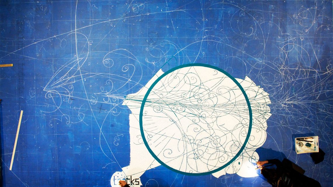 Overhead photograph of the sand mandala with the central circle completed