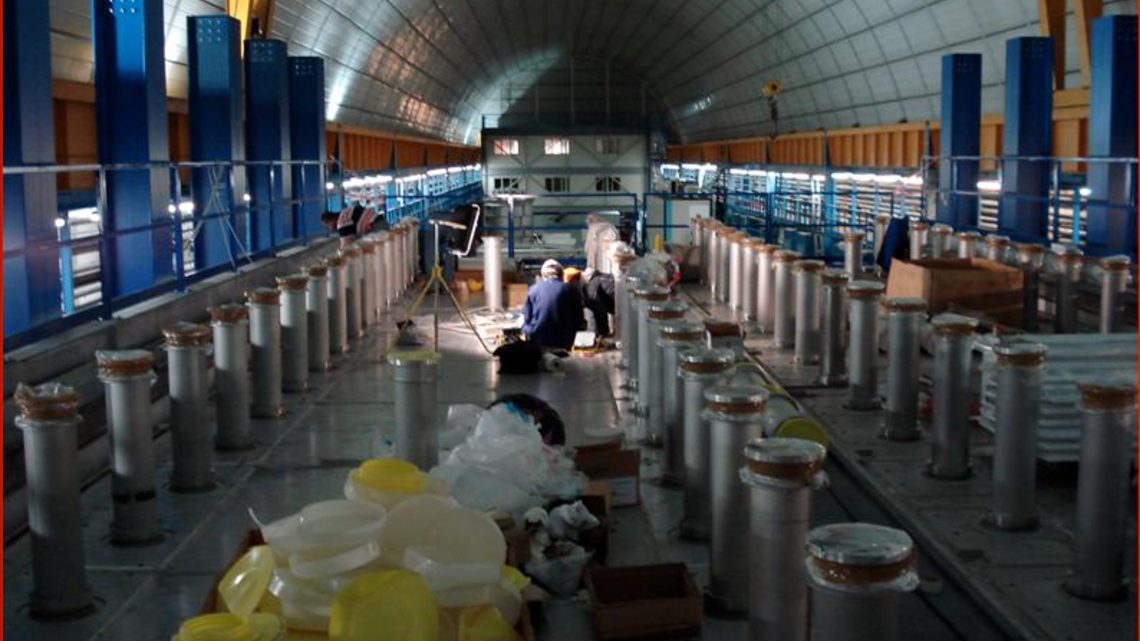 Photograph of scientists installing the ICARUS detector at Gran Sasso