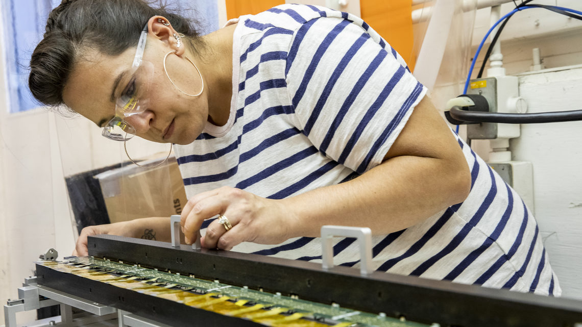 Nicole Apadula inspects a detector stave