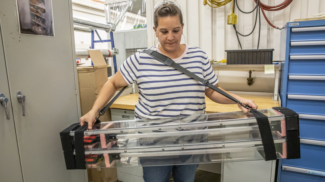Nicole Apadula holds a custom-built carrying case