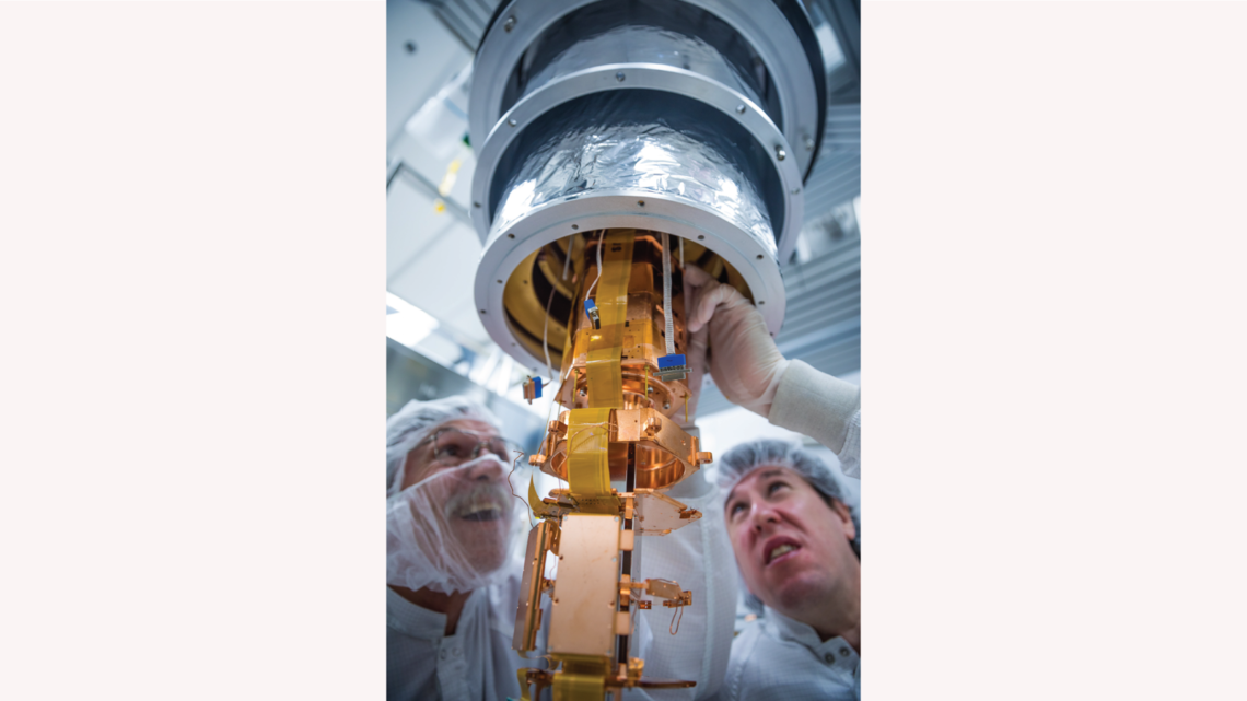 SLAC's Mike Racine (left) and Paul Brink are installing the SuperCDMS SNOLAB engineering tower into the dilution fridge test fac