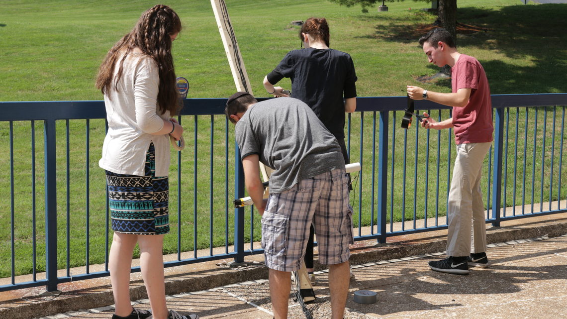Photo of Glenbrook North High School students assembling equipment