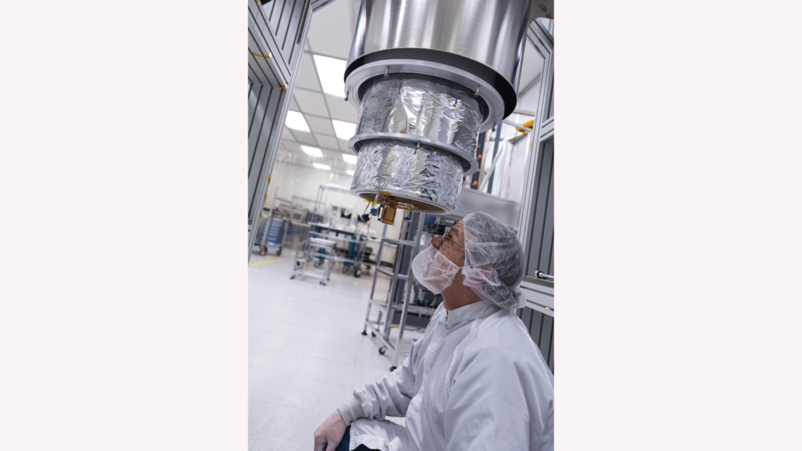SLAC's Mike Racine is inspecting the SuperCDMS SNOLAB engineering tower, which has been installed into the dilution fridge test 