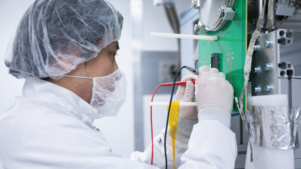 SLAC's Tsuguo Aramaki is preforming a diagnostic checkout of the SuperCDMS SNOLAB engineering tower installed at the dilution fr