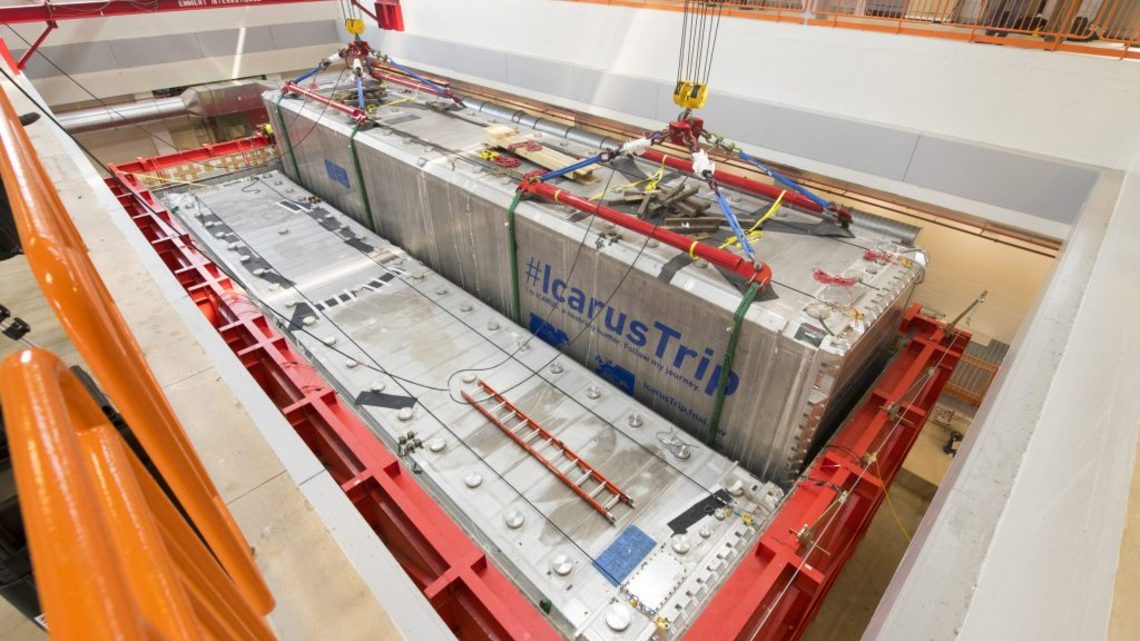 The ICARUS detector being lowered into place by crane