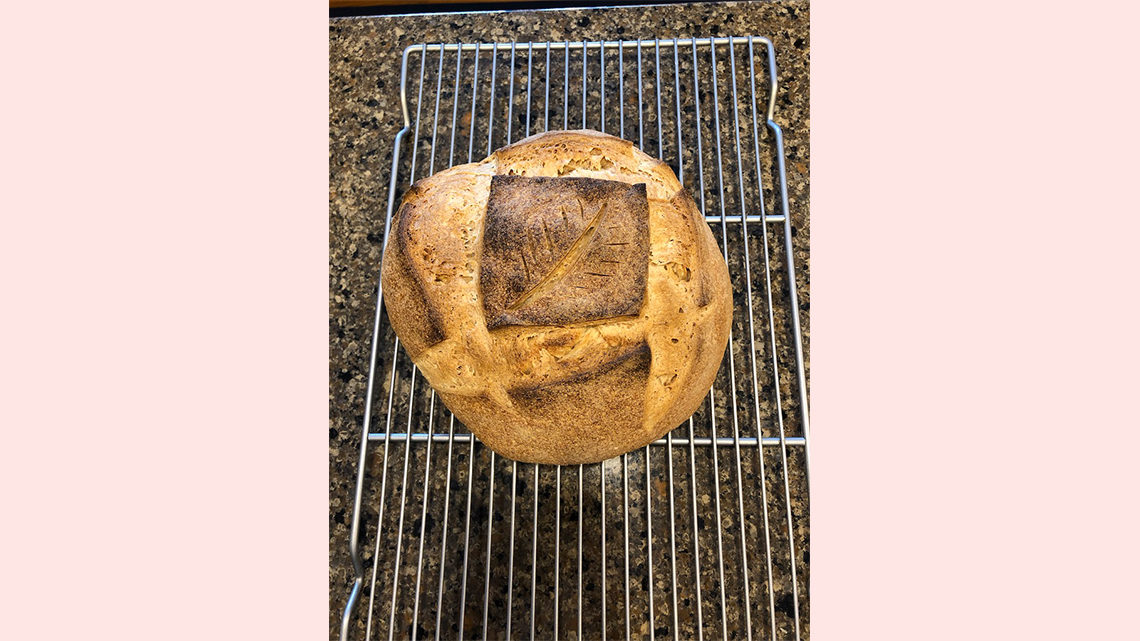 A decorated sourdough boule