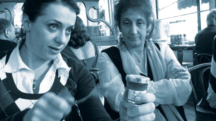 Experimental physicist Maria Spiropulu, left, illustrates ideas for Liz Lerman over brunch in Geneva. 