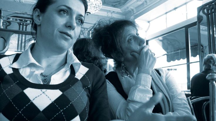 Experimental physicist Maria Spiropulu, left, illustrates ideas for Liz Lerman over brunch in Geneva. 