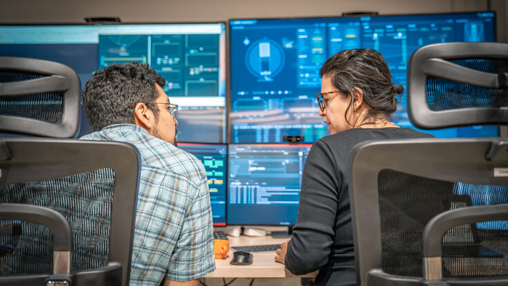 NOIRLab observing specialists Carlos Morales (left) and Karla Peña (right) in the Rubin summit control room at Rubin’s mountaintop site of Cerro Pachón, Chile.