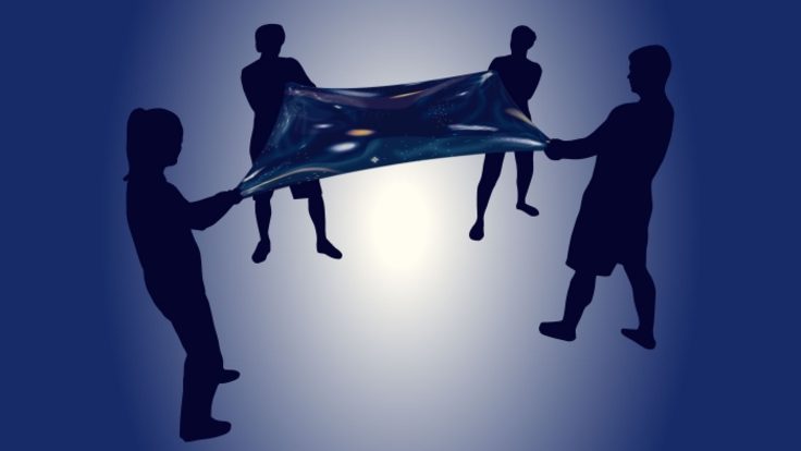 Four people pulling on four corners of a space blanket 