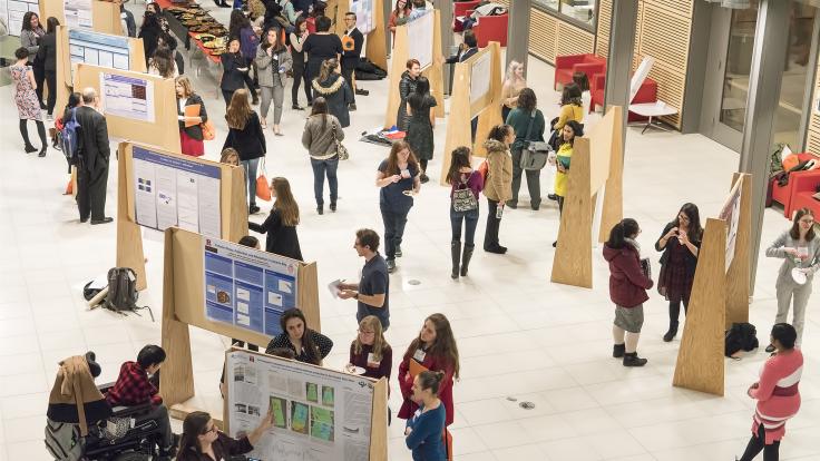 Photo of many CUWiP programs include a poster session where students have the opportunity to describe research