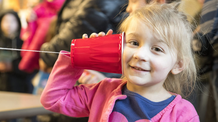 Kid with a string telephone