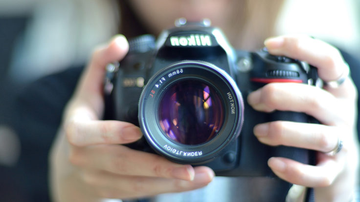 Image of person holding a camera